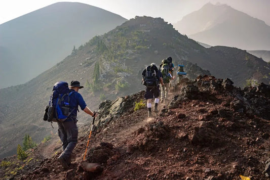 People-trekking-with-lots-of-equipment-on-them